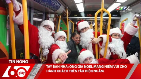 TÂY BAN NHA: ÔNG GIÀ NOEL MANG NIỀM VUI CHO HÀNH KHÁCH TRÊN TÀU ĐIỆN NGẦM